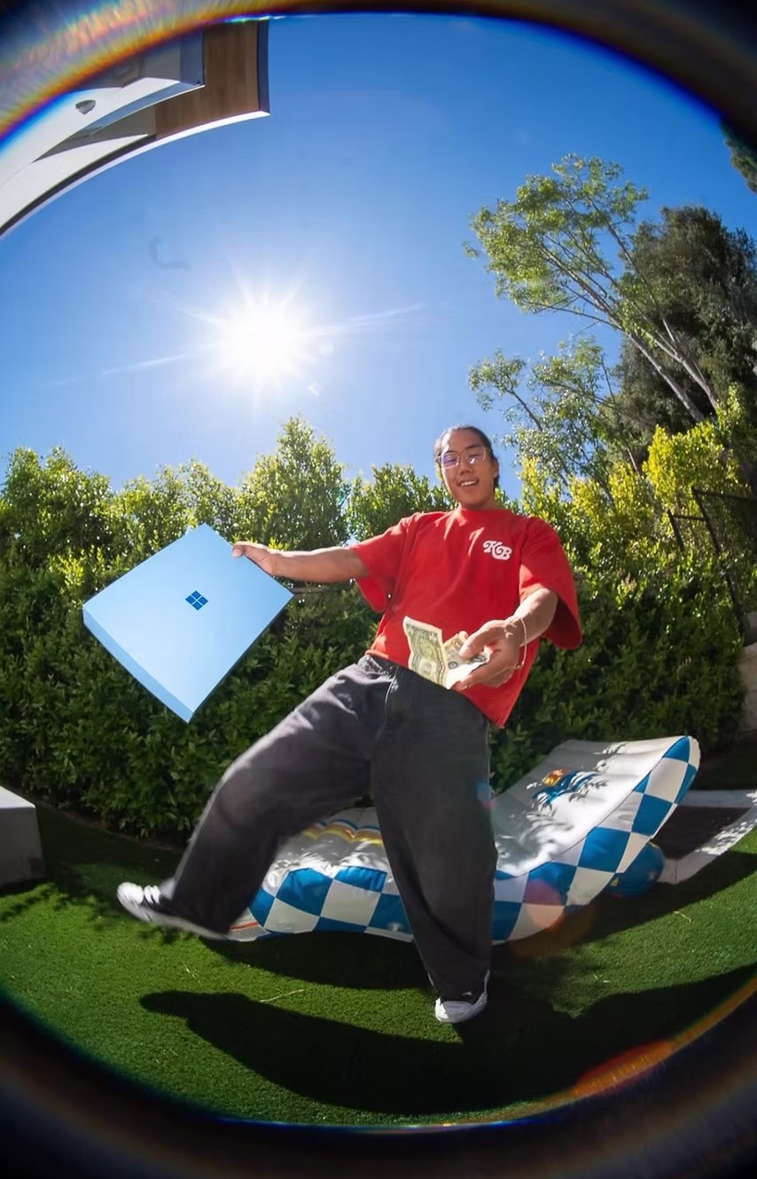 James Seo holding a Surface box, shot fisheye for the Microsoft Back to School campaign